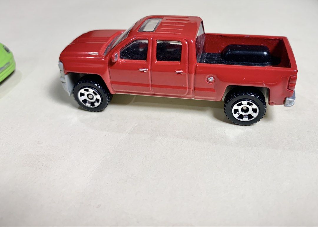 Mbx and Hotwheel 2x lot (Category: Vehicle & Diecast Models) located in Mandaue City. Submitted by maxguiller89260 (Listing ID 1463512115, Image 2). Description: 2 unit lot West Coast sourced thrift item shop 2014 Chevrolet Silverado 1500 double-cab pickup 1:64 standard MBX Explorers Cherry Red non chrome front variant (originally released as number 29/120) Thailand - [ ] Brand: Hot Wheels - [ ] Volkswagen Beetle - [ ] Lime green / black race str