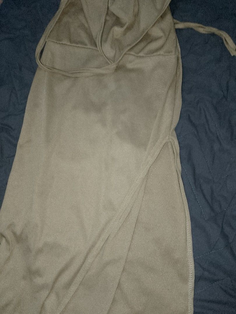 mexi long dress with slit (Category: Dresses) located in Cainta. Submitted by meadow_collection123 (Listing ID 1463510336, Image 3). Description: XS TO SMALL An elegant beige halter-style maxi dress with a flowy, minimalist silhouette. It features a tie-up neckline, a layered bust detail, and a side tie accent for an adjustable fit. Lightweight and breathable fabric, making it perfect for casual days, beach outings, or dressed-up occasions..