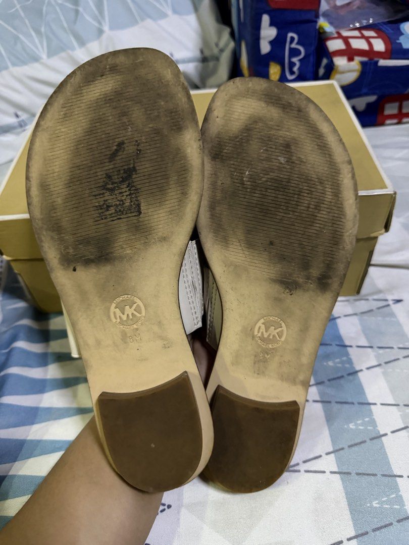 Michael Kors August Flat Sandals Cream US 8 (Category: Flats & Sandals) located in Pasig City. Submitted by aprilluxcloset0812 (Listing ID 1463478945, Image 2). Description: - Michael Kors August flat sandals - Color: Cream - Material: Leather upper - Design: Toe loop and wide strap with MK logo detail - Size: US 8 - Condition: Soles show some wear from use - Includes: Original box RFS: decluttering EVERYTHING MUST GO‼️Just make a reasonable offe