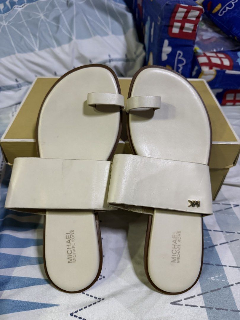 Michael Kors August Flat Sandals Cream US 8 (Category: Flats & Sandals) located in Pasig City. Submitted by aprilluxcloset0812 (Listing ID 1463478945, Image 1). Description: - Michael Kors August flat sandals - Color: Cream - Material: Leather upper - Design: Toe loop and wide strap with MK logo detail - Size: US 8 - Condition: Soles show some wear from use - Includes: Original box RFS: decluttering EVERYTHING MUST GO‼️Just make a reasonable offe