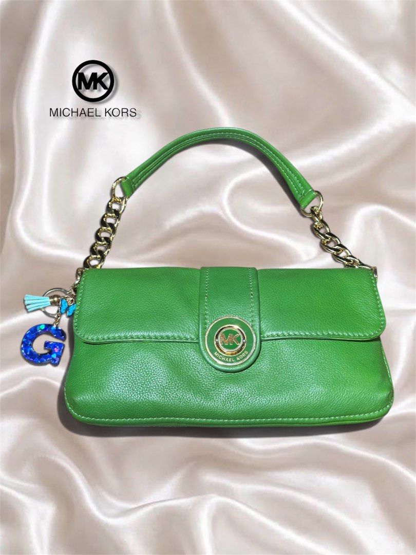 Michael Kors Green Leather Shoulder Bag with Charm (Category: Luxury Bags & Wallets) located in Cebu City. Submitted by gabgaaab (Listing ID 1463376521, Image 2). Description: - Michael Kors Green Leather Shoulder Bag with Charm - Excellent Condition - Features a stylish gold chain strap - Comes with a fun blue glitter 'G' charm - Ideal for casual outings or adding a pop of color - Secure snap closure - Approximately 10 inches wide - Actual pics 