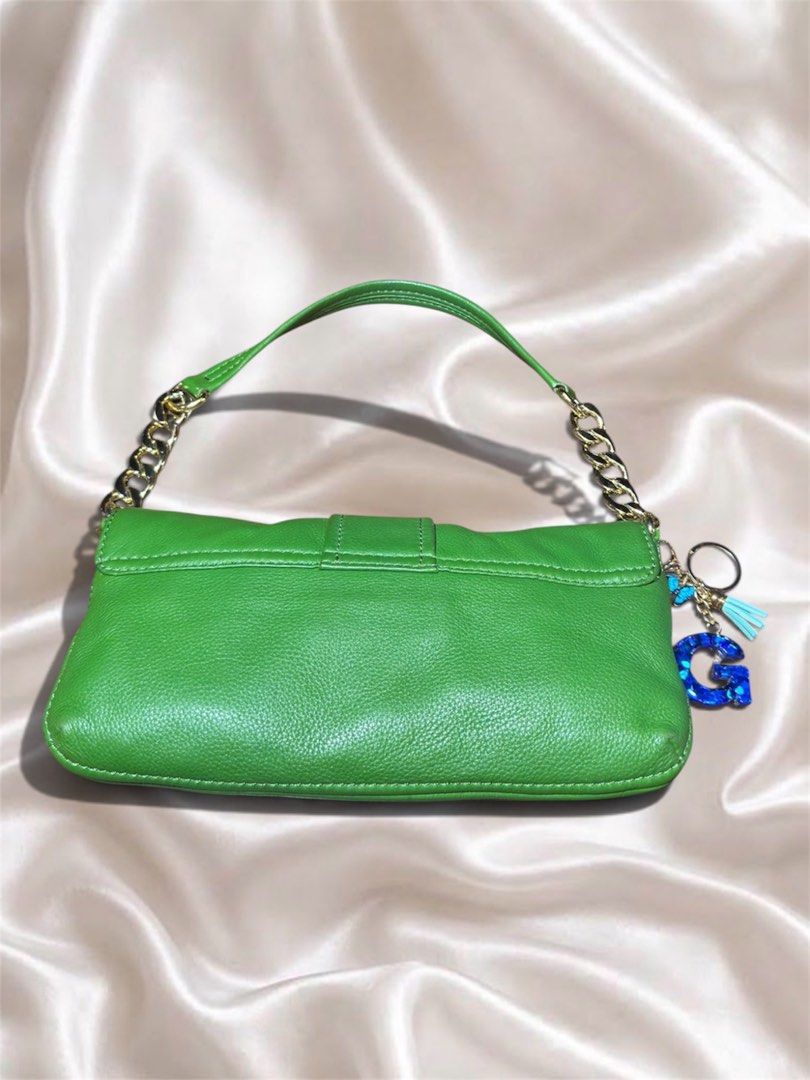 Michael Kors Green Leather Shoulder Bag with Charm (Category: Luxury Bags & Wallets) located in Cebu City. Submitted by gabgaaab (Listing ID 1463376521, Image 3). Description: - Michael Kors Green Leather Shoulder Bag with Charm - Excellent Condition - Features a stylish gold chain strap - Comes with a fun blue glitter 'G' charm - Ideal for casual outings or adding a pop of color - Secure snap closure - Approximately 10 inches wide - Actual pics 
