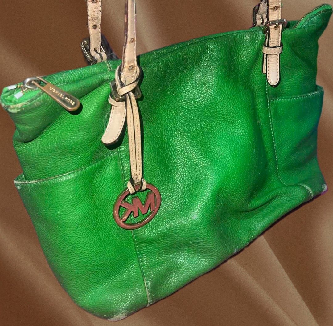 Michael Kors Green Tote Bag (Category: Tote Bags) located in Rizal. Submitted by youngpenguin.ae303d (Listing ID 1463357029, Image 1). Description: Decluttering Note: This bag has visible signs of use, as shown in the photos. Minor scratches and marks are visible..