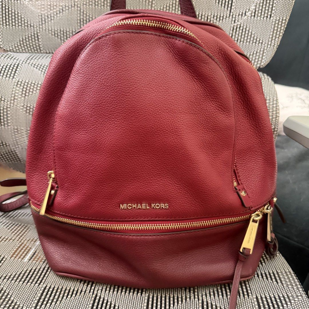 Michael Kors Leather Backpack Burgundy (Category: Backpacks) located in Cebu City. Submitted by eynjlin (Listing ID 1463475184, Image 1). Description: - Michael Kors leather backpack - Deep burgundy color - Gold-tone hardware - Main compartment with zip closure - Interior zip pocket and slip pockets - Adjustable shoulder straps - Ideal for everyday use.