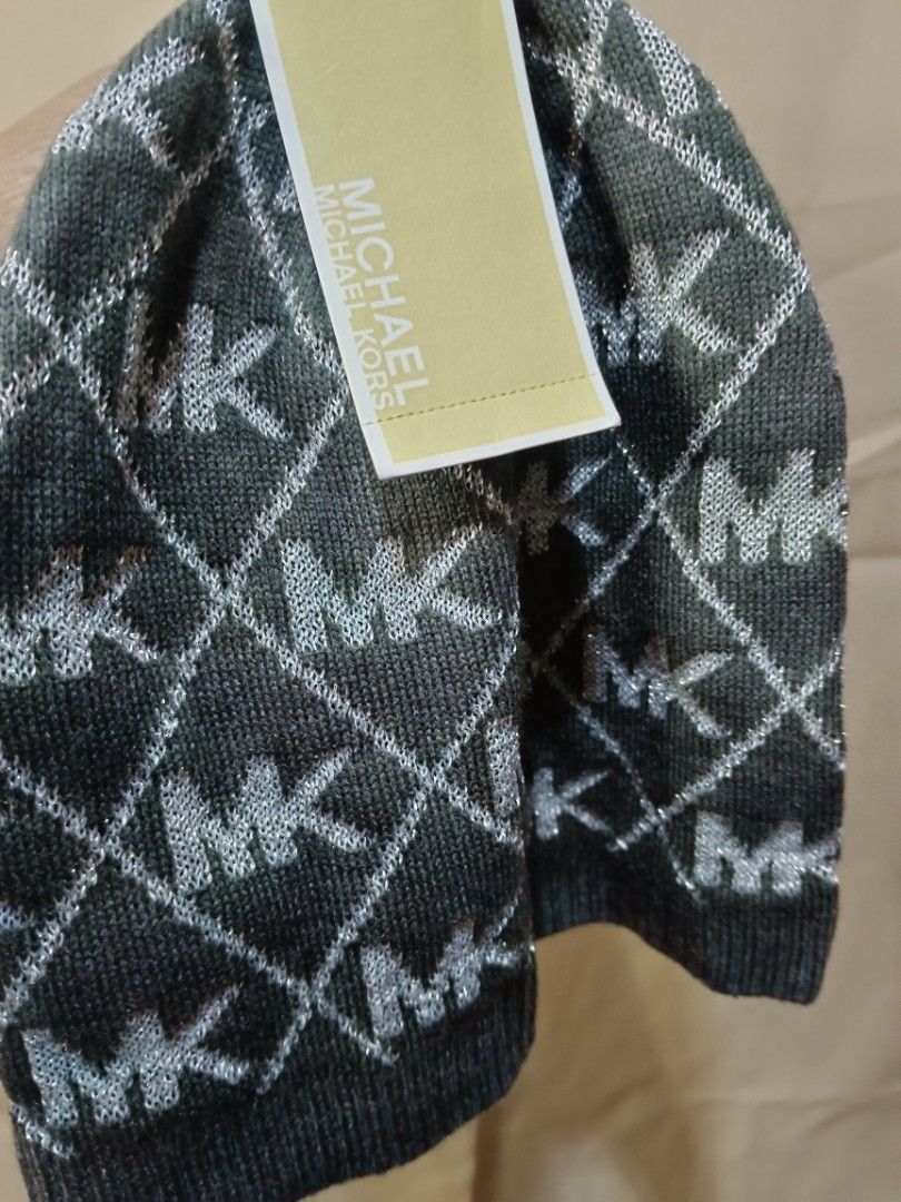 Michael Kors MK Logo Knit Beanie Hat (Category: Hats & Beanies) located in Manila. Submitted by rabpisces23 (Listing ID 1463484246, Image 1). Description: - Grey knit beanie - All-over silver MK logo pattern - Sparkly threads woven in - Comes with original tags - Size: One Size (O/S) - Original MSRP: $38.00.