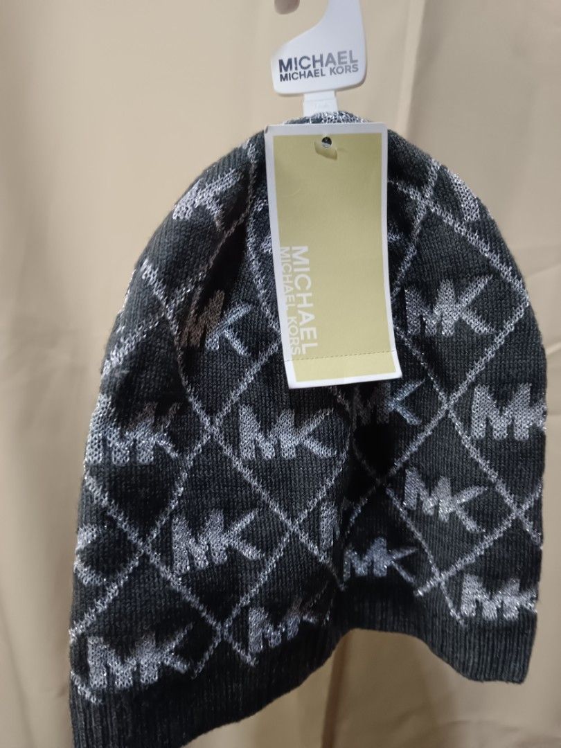 Michael Kors MK Logo Knit Beanie Hat (Category: Hats & Beanies) located in Manila. Submitted by rabpisces23 (Listing ID 1463484246, Image 2). Description: - Grey knit beanie - All-over silver MK logo pattern - Sparkly threads woven in - Comes with original tags - Size: One Size (O/S) - Original MSRP: $38.00.