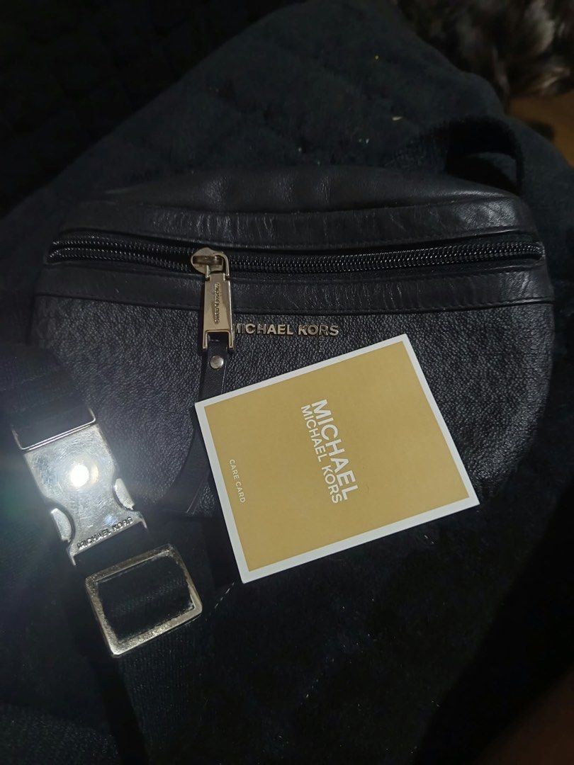Michael Kors Monogram Belt Bag (Category: Luxury Bags & Wallets) located in San Mateo. Submitted by darlynlaguna (Listing ID 1463382854, Image 2). Description: - Authentic Michael Kors belt bag - Color: Black monogram print with leather trim - Closure: Zipper - Strap: Adjustable with buckle - Features: Hands-free convenience, fits phone, wallet, keys - Includes: Care card.