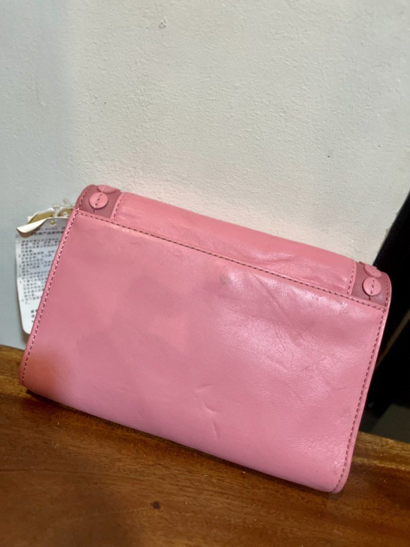 Michael Kors Pink Leather Wallet with Strap (Category: Wallets & Card holders) located in Bacolod City. Submitted by vintage_vogue6100 (Listing ID 1463385206, Image 2). Description: - Genuine pink Michael Kors wallet - Premium leather with elegant scalloped edge detail - Versatile long strap for crossbody wear - Ample card slots and secure zip pocket inside - Stylish gold hardware - Comes with original tag, brand new.