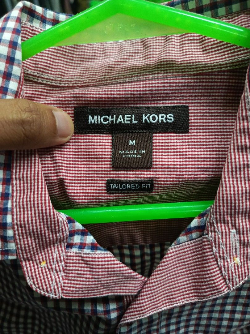 Michael Kors Tailored Fit Gingham Shirt Size M (Category: Tshirts & Polo Shirts ) located in Cabatuan. Submitted by penthegreat (Listing ID 1463472650, Image 2). Description: - Michael Kors Button-Up Shirt - Classic Gingham Pattern (Navy & Red) - Tailored Fit - Size: Medium (M) - Versatile for Casual or Smart-Casual Occasions - Easy to Style with Jeans or Trousers.