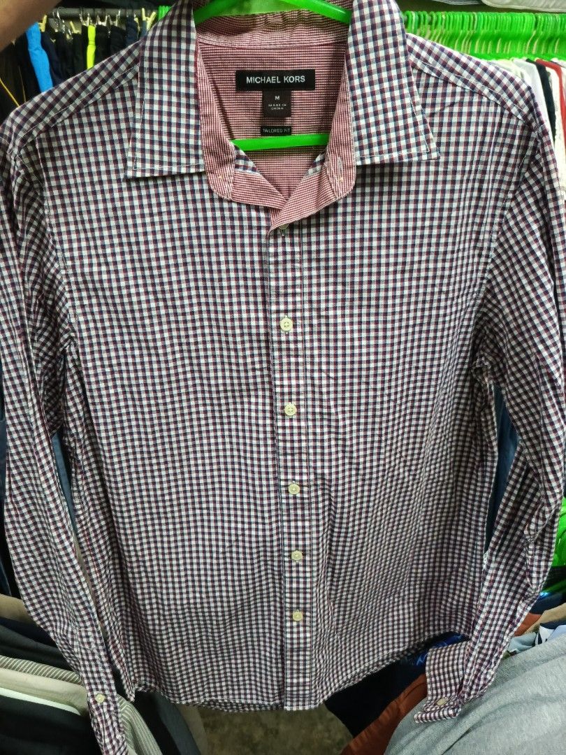Michael Kors Tailored Fit Gingham Shirt Size M (Category: Tshirts & Polo Shirts ) located in Cabatuan. Submitted by penthegreat (Listing ID 1463472650, Image 1). Description: - Michael Kors Button-Up Shirt - Classic Gingham Pattern (Navy & Red) - Tailored Fit - Size: Medium (M) - Versatile for Casual or Smart-Casual Occasions - Easy to Style with Jeans or Trousers.