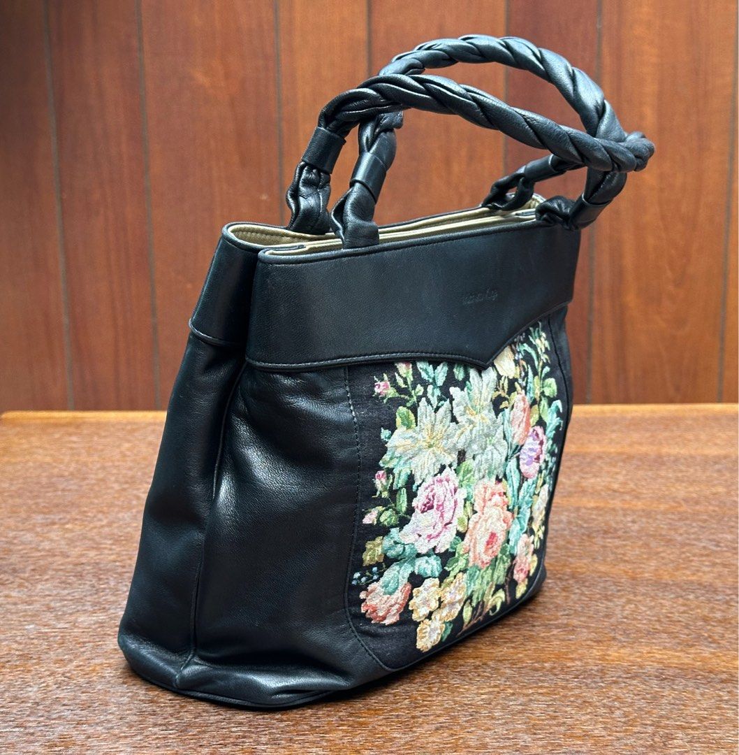 Michiko Kuge handbag (Category: Shoulder Bags) located in Bulacan. Submitted by thriftbagcollections (Listing ID 1463394971, Image 2). Description: Michiko Kuge handbag featuring a colorful floral petit point tapestry panel and a braided leather handle,looks unused.Approx;H-8”W-8.5”D-3.7”handle 5.5”.