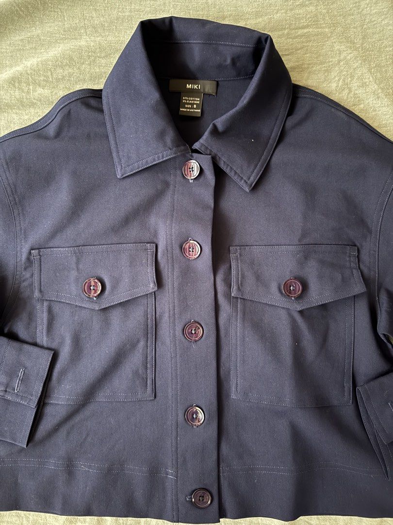 MIKI Navy Blue Cropped Button-Up Jacket (Category: Coats, Jackets and Outerwear) located in Manila. Submitted by tricia_lara (Listing ID 1463357690, Image 2). Description: Got this from vietnam at around 1400 pesos!! :) never worn but washed once :) it’s very light & perfect for chill fits or work fits 🫶🏻.