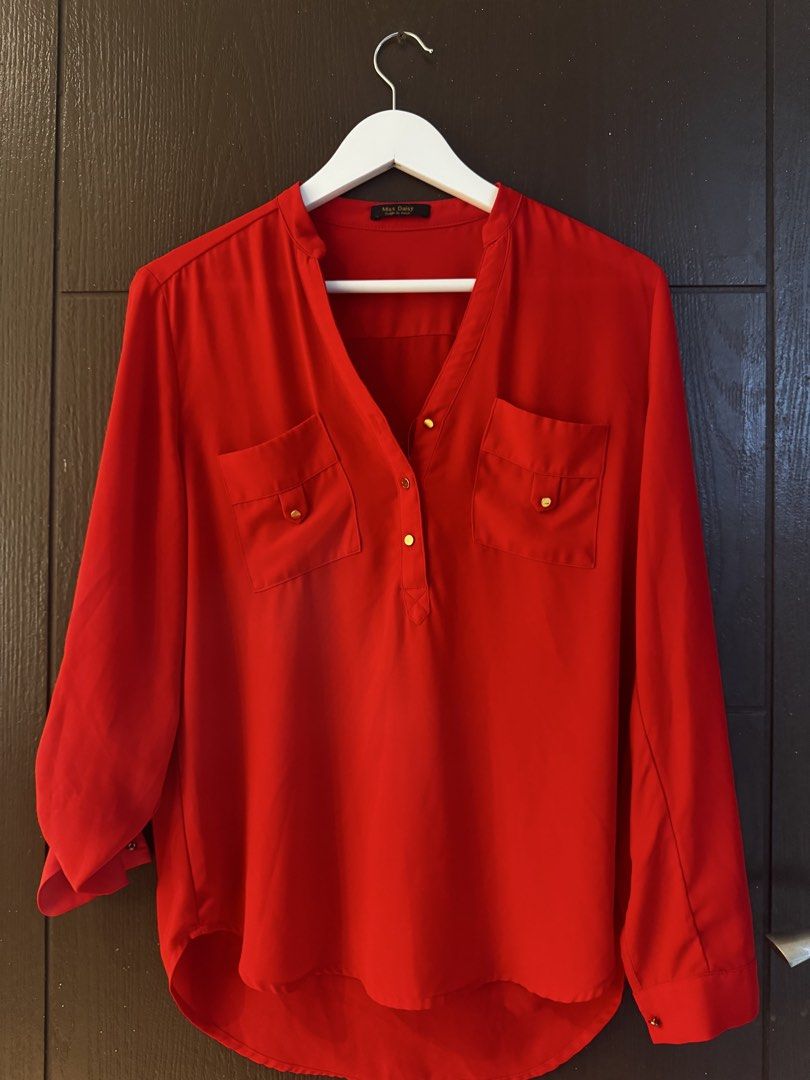 Miss Daisy Design by Korea Red Blouse (Category: Blouses) located in Paranaque City. Submitted by keyrends (Listing ID 1463418787, Image 2). Description: - Red blouse from Miss Daisy - Korean design - Two chest pockets with gold buttons - Roll-up sleeves with button tab - V-neckline with a small collar - Lightweight material.
