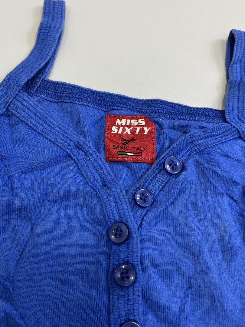 Miss Sixty Blue Button Up Tank Top (Category: Sleeveless) located in Mabalacat. Submitted by aas_thriftfings (Listing ID 1463377675, Image 2). Description: - Blue Miss Sixty tank top - Ribbed fabric for a comfortable fit - Button-up front with small, stylish buttons - Ideal for everyday casual wear.