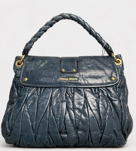 Miumiu Gray Matelasse Nappa Leather Coffer Hobo Bag (Category: Luxury Bags & Wallets) located in Caloocan City. Submitted by hermes_evangelista (Listing ID 1463334721, Image 2). Description: Show off your style with this versatile investment piece. The Miu Miu Gray Matelasse Nappa Leather Coffer Hobo Bag has a fantastic braided top handled as well as a shoulder strap for hands-free convenience when you feel like it. The matelasse leather is butte