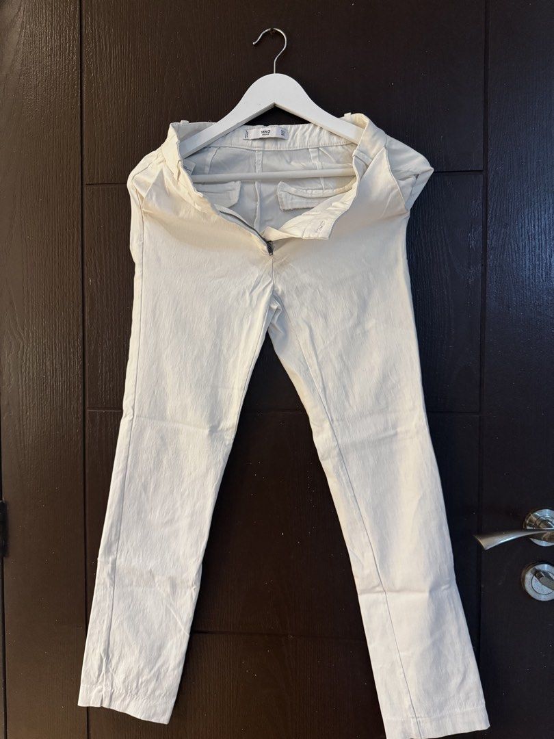 MNG Basics Cream/White Chinos Pants (Category: Other Bottoms) located in Paranaque City. Submitted by keyrends (Listing ID 1463418794, Image 2). Description: - Cream colored chinos from MNG Basics - Straight leg fit - Zipper fly with button closure - Two front pockets and two back pockets - Versatile for casual or smart casual looks - Easy to pair with any top.