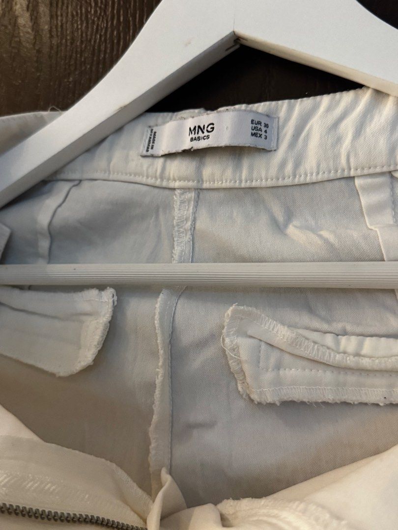 MNG Basics Cream/White Chinos Pants (Category: Other Bottoms) located in Paranaque City. Submitted by keyrends (Listing ID 1463418794, Image 3). Description: - Cream colored chinos from MNG Basics - Straight leg fit - Zipper fly with button closure - Two front pockets and two back pockets - Versatile for casual or smart casual looks - Easy to pair with any top.