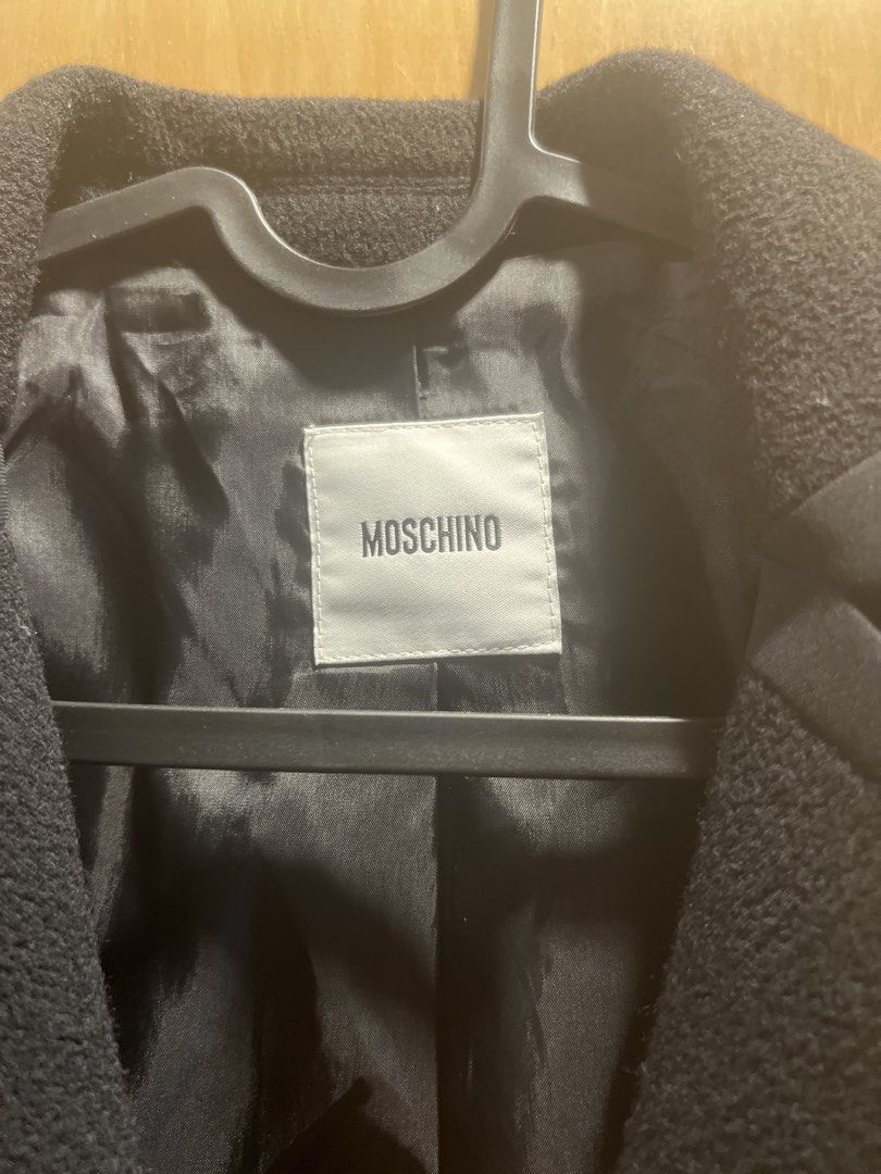 MOSCHINO Black Blazer Jacket with Newspaper Print Lining (Category: Coats, Jackets and Outerwear) located in Pasig City. Submitted by butterflyt13249 (Listing ID 1463432132, Image 2). Description: - Authentic Moschino blazer in black - Textured outer fabric for a sophisticated look - Smooth satin lining with a cool newspaper print - Classic button-front closure - Convenient side pockets - Perfect for dressing up or down, adding a unique touch to 