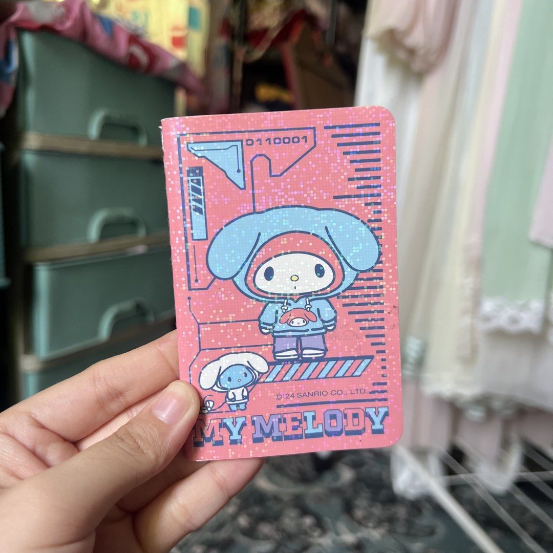 My Melody Sanrio Mini Notebook (Category: Stationery & School Supplies) located in Quezon City. Submitted by mei_declutters (Listing ID 1463405127, Image 1). Description: - Adorable My Melody notebook in pink - Features glittery details and cute characters - Compact and portable size, ideal for on-the-go notes - Makes a lovely small gift - Authentic licensed Sanrio product.