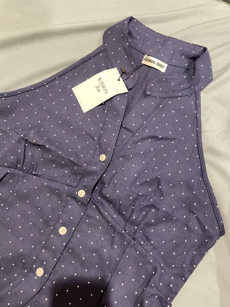 Navy Blue Polka Dot Halter Neck Sleeveless Top (Category: Sleeveless) located in Davao. Submitted by taegikook (Listing ID 1463524548, Image 2). Description: - Brand new, never worn and still w/ tags! - Bought in SG but it’s too big on me 😅 - See measurements in last pics! - Width: 18 inches, Length: 23 inches - Button-up front with collar + Fitted waist for a flattering silhouette Loc: Davao City MOD: J&T, Flash Express.