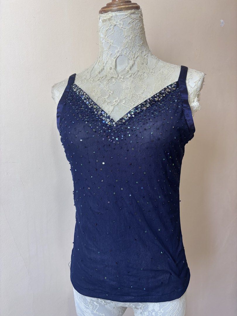 Navy Blue Sequin V-Neck Tank Top (Category: Sleeveless) located in Manila. Submitted by galitsabarat (Listing ID 1463551445, Image 1). Description: S to M size - Navy blue sheer tank top - All-over small shimmering sequins - V-neckline with sparkly embellishments - Thin satin straps - Ideal for layering or wearing solo - Adds a touch of sparkle to any outfit.