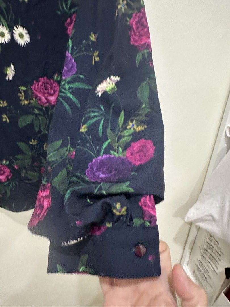 Navy Floral Mock Neck Long Sleeve Blouse Medium (Category: Blouses) located in Manila. Submitted by roseluxuryitems (Listing ID 1463474097, Image 3). Description: - Navy blue long sleeve blouse - Beautiful floral print with pink & purple roses and white daisies - Mock neck design - Button closure at the back - Cuffed sleeves with button detail - Perfect for dressing up or down.