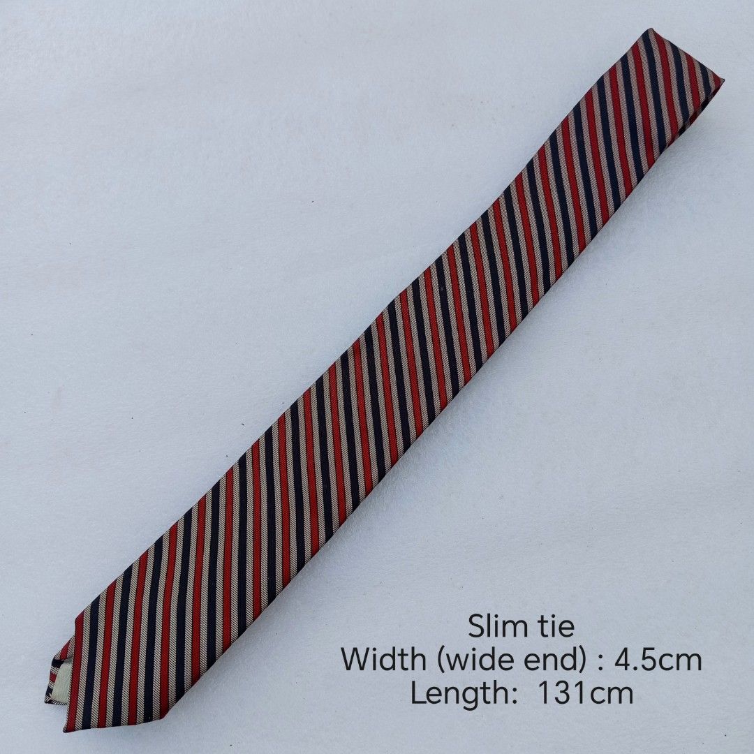 Navy, Red & Cream Diagonal Repp Striped necktie (Category: Ties) located in Abucay. Submitted by gibzzz123 (Listing ID 1463375488, Image 2). Description: • All items are ON HAND and ready to be shipped/picked up. • Items are preloved/ukay, so please expect minimal signs of usage unless stated otherwise. • No major issues — good condition unless otherwise indicated in the listing. • Actual color may slightly vary due to lighting and screen setting