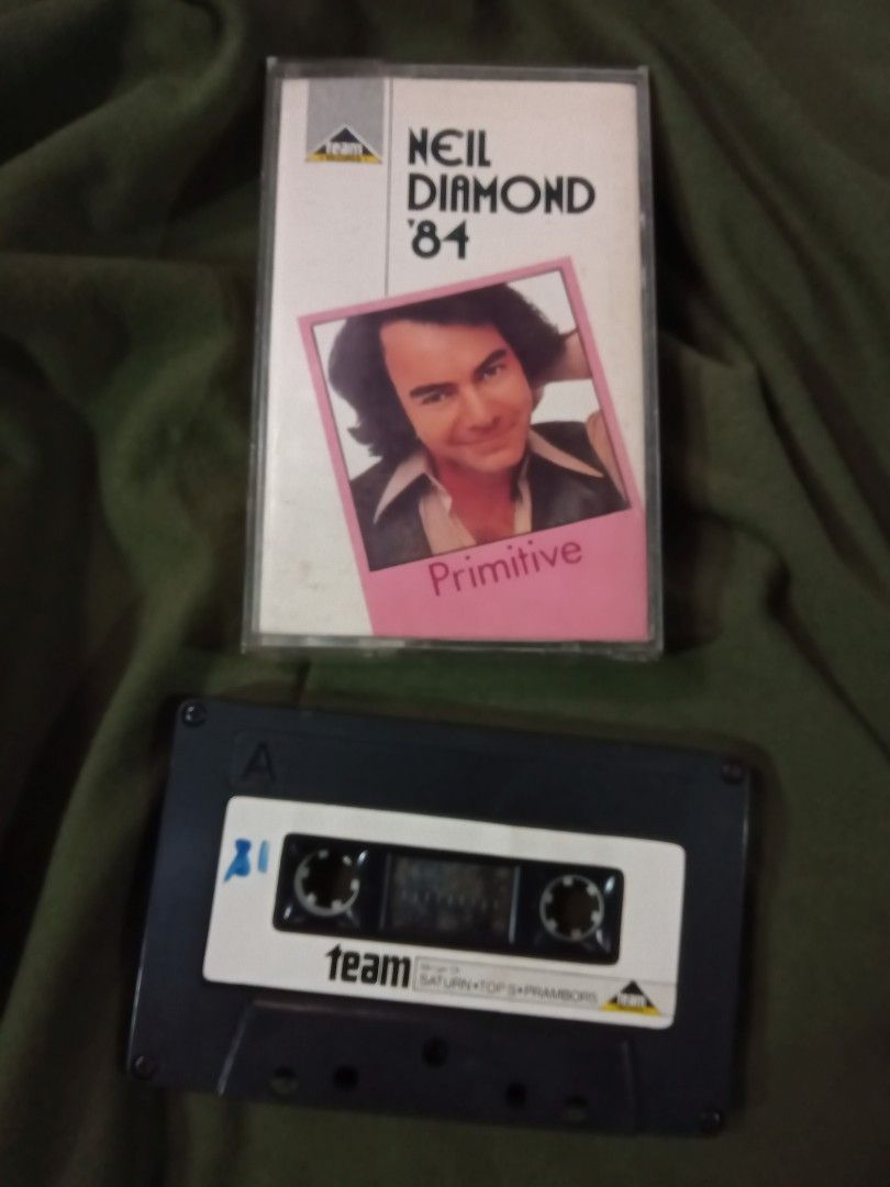 NEIL DIAMOND '84 PRIMITIVE CASSETTE TAPE (Category: Other Audio Equipment) located in Valenzuela. Submitted by tapeheads90s (Listing ID 1463449540, Image 1). Description: cassette tape tested playable case not graded 1st to pay add shipping fee via J&T lalamove mop: gcash valenzuela city.