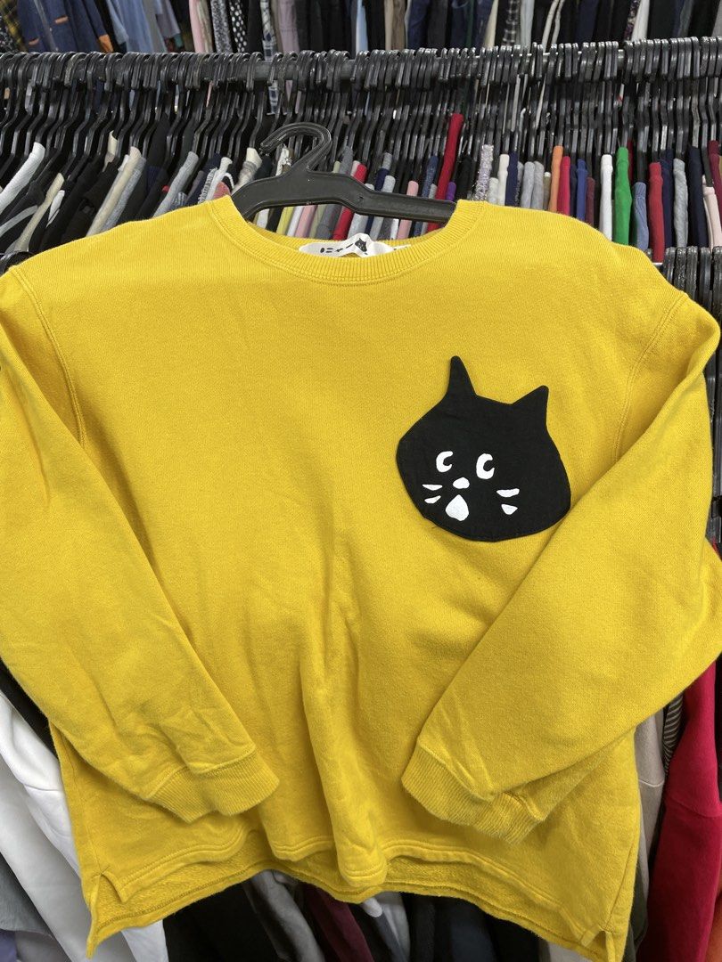 Ne-net Pocket Sweatshirt Made in Japan (Category: Coats, Jackets and Outerwear) located in Lucena. Submitted by riyizthriftz (Listing ID 1463496795, Image 1). Description: - Adorable yellow sweatshirt - Features a cute black cat pocket design - Made in Japan - Material: 100% Cotton (5% Polyurethane ribbing) - Ideal for casual wear - Easily pairs with jeans or skirts - A fun and stylish addition to your wardrobe - Good condition - Color rate 9/10 