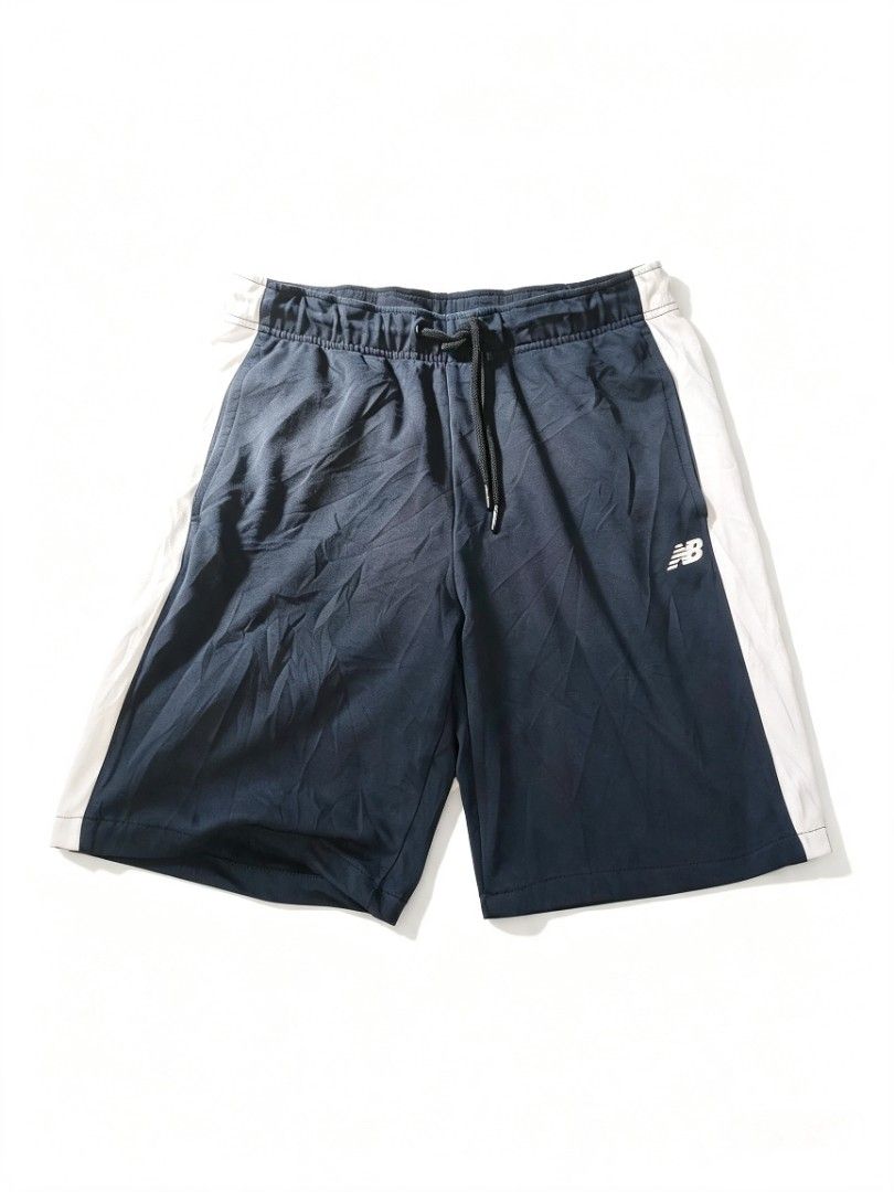 New Balance Athletic Shorts Navy Blue (Category: Shorts) located in Manila. Submitted by thrift_for_good (Listing ID 1463370899, Image 1). Description: - Brand: New Balance - Color: Navy Blue - Style: Athletic Shorts - Features: Drawstring waist, side panels - Material: Cotton-Polyester blend - Condition: Well Worn and Still Running (as per tag) - Ideal for: Workouts, casual wear.