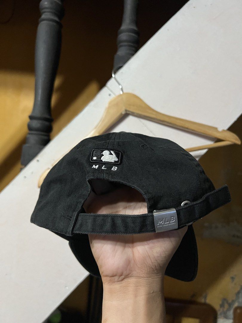 New York Yankees MLB Black Baseball Cap (Category: Caps & Hats) located in Butuan. Submitted by nikthrift. (Listing ID 1463335432, Image 2). Description: - Classic black cap with iconic NY Yankees logo - MLB official merchandise - Adjustable strap for a comfortable fit - Perfect for everyday wear or streetwear.