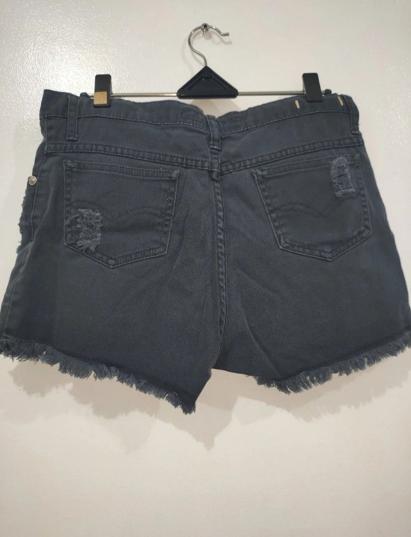 NEXT JEANS Distressed Denim Shorts Size M (Category: Shorts) located in Quezon City. Submitted by maxsab (Listing ID 1463549454, Image 3). Description: - Brand: NEXT JEANS - Color: Grey Denim - Style: High-waisted shorts - Features: Distressed look with rips and frayed hem - Size: Medium (M) - Occasion: Casual wear.