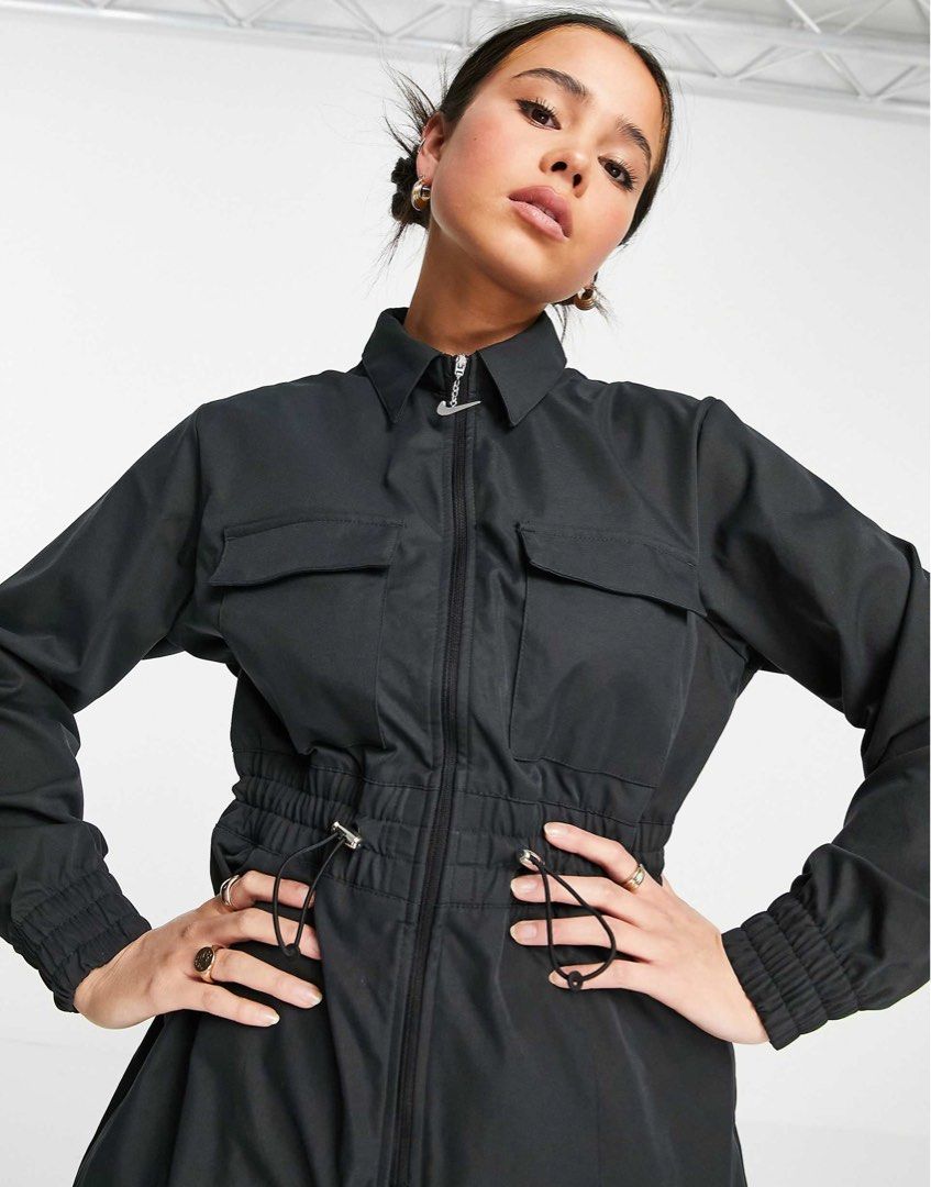 Nike (Category: Jumpsuits) located in Baguio. Submitted by yschoiceph (Listing ID 1463334612, Image 3). Description: Nike Sportswear Swoosh Women's Utility Jumpsuit, featuring a large outlined white Swoosh on the back and practical cargo pockets on the legs. Excellent Medium.