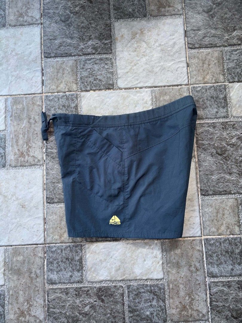 Nike ACG Shorts Size M Dark Grey (Category: Shorts) located in Iriga City. Submitted by thrifttobicol29 (Listing ID 1463451609, Image 2). Description: - Nike ACG Shorts - Color: Dark Grey - Size: Medium (M) - Features: Elastic waistband with drawstring, multiple pockets - Ideal for: Outdoor activities, casual wear - Origin: Made in Vietnam - Nike ACG Medium Waist 30 Length 13 Excellent condition.