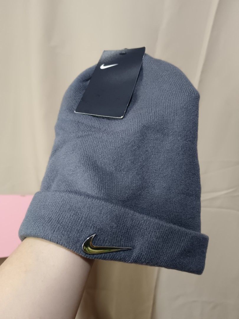 Nike Beanie Hat - Grey (Category: Caps & Hats) located in Manila. Submitted by rabpisces23 (Listing ID 1463486267, Image 2). Description: - Grey Nike beanie - Brand new with Nike logo tag still attached - Features a metallic gold Nike swoosh detail on the cuff - Standard beanie size, fits most - Ideal for keeping warm during colder weather.