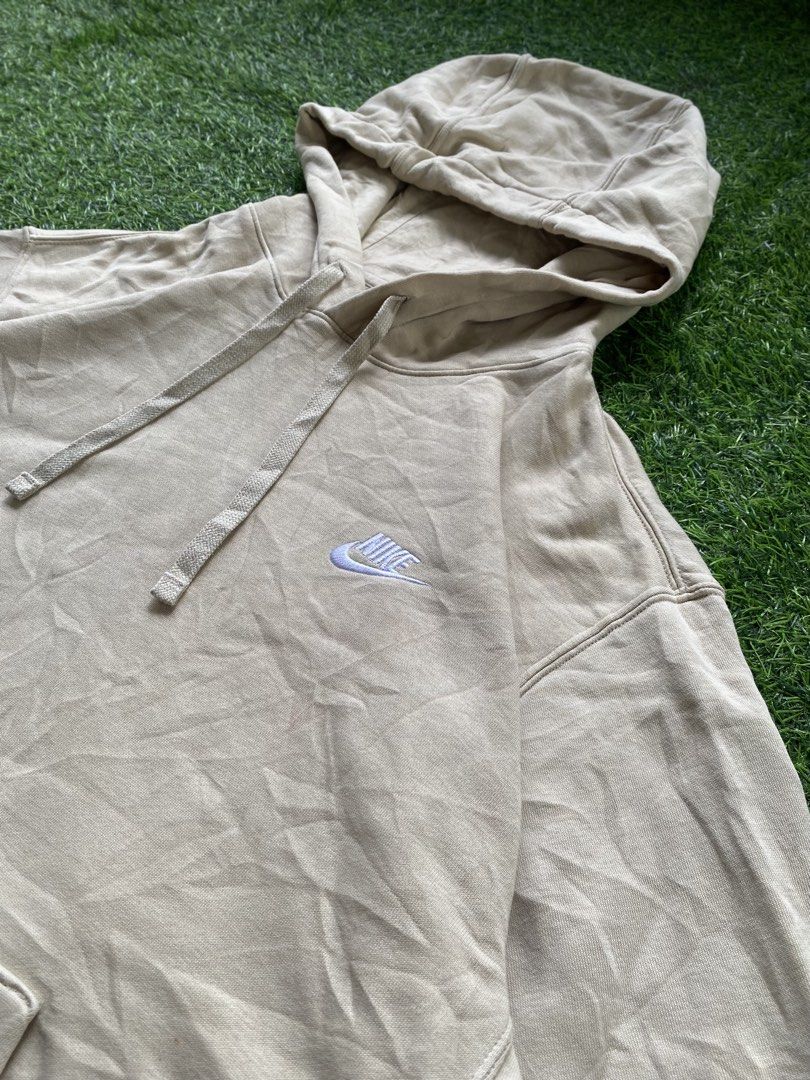 Nike Beige Pullover Hoodie (Category: Hoodies) located in Manila. Submitted by clevermountain_9c1516 (Listing ID 1463551380, Image 2). Description: - Classic beige Nike hoodie - Size: Large - Iconic embroidered Nike swoosh logo on chest - Front kangaroo pocket - Adjustable drawstring hood - Made in Vietnam -24 width 28 length .