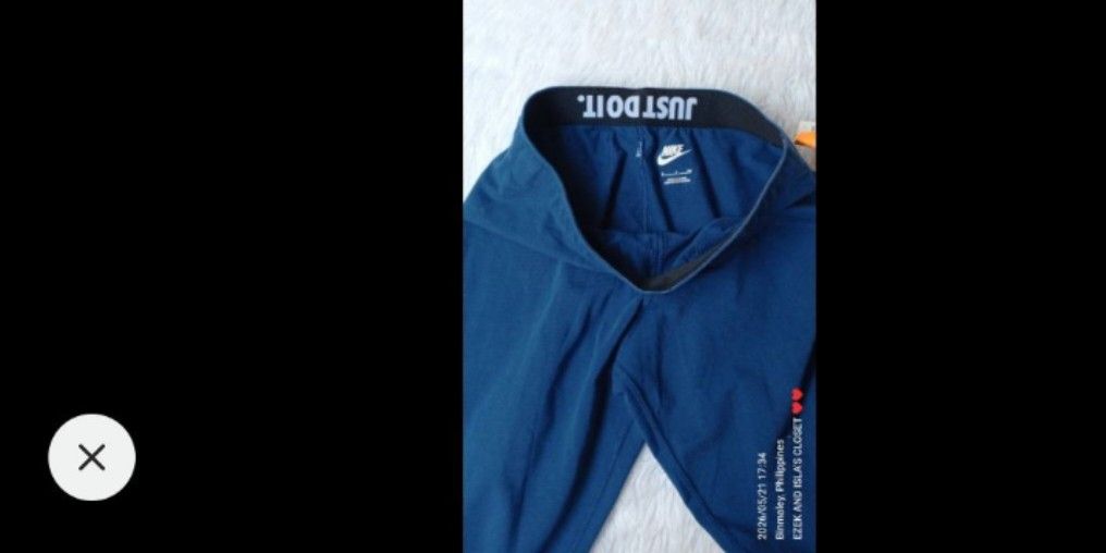 Nike Blue Leggings with Silver "Just Do It" Logo (Category: Activewear) located in Manila. Submitted by ezekislacl02490 (Listing ID 1463370259, Image 2). Description: - Blue Nike leggings - Features silver "Just Do It" logo on the side - Elastic waistband with "Just Do It" text detail - Ideal for workouts or casual wear - Comfortable and stylish design.