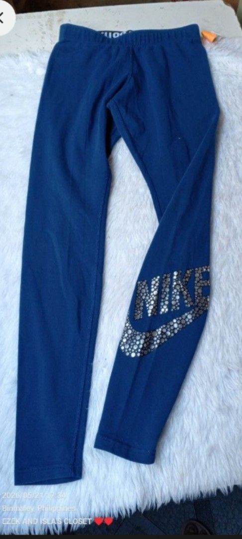 Nike Blue Leggings with Silver "Just Do It" Logo (Category: Activewear) located in Manila. Submitted by ezekislacl02490 (Listing ID 1463370259, Image 1). Description: - Blue Nike leggings - Features silver "Just Do It" logo on the side - Elastic waistband with "Just Do It" text detail - Ideal for workouts or casual wear - Comfortable and stylish design.
