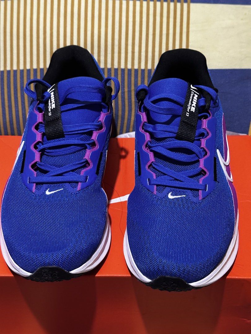 Nike Downshifter 13 Blue/White/Hyper Violet Running Shoes (Category: Activewear) located in Pasig City. Submitted by chesca_closet (Listing ID 1463520972, Image 1). Description: - Nike Downshifter 13 running shoes - Color: Blue with purple and white accents - Size: Men's UK 8 / Women's UK 7 - Ideal for running and everyday wear - Comes with original box **original price 3k, but selling it now a lower price. **never been worn **reason for selling 