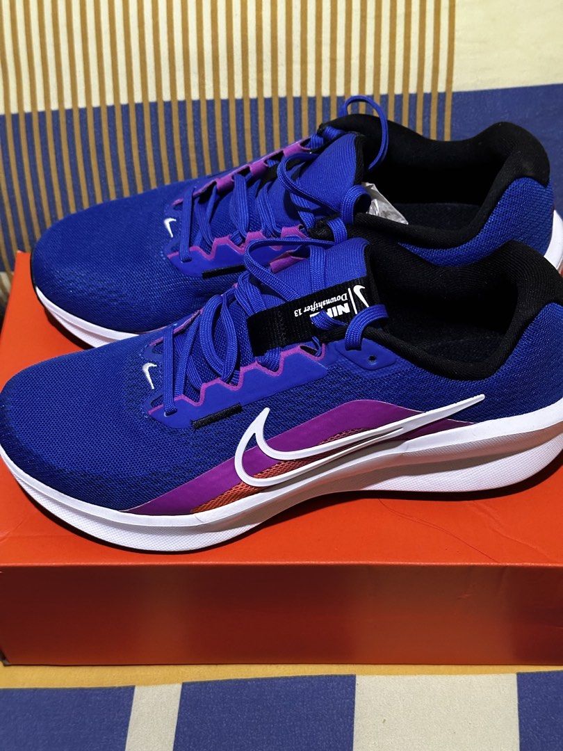 Nike Downshifter 13 Blue/White/Hyper Violet Running Shoes (Category: Activewear) located in Pasig City. Submitted by chesca_closet (Listing ID 1463520972, Image 3). Description: - Nike Downshifter 13 running shoes - Color: Blue with purple and white accents - Size: Men's UK 8 / Women's UK 7 - Ideal for running and everyday wear - Comes with original box **original price 3k, but selling it now a lower price. **never been worn **reason for selling 