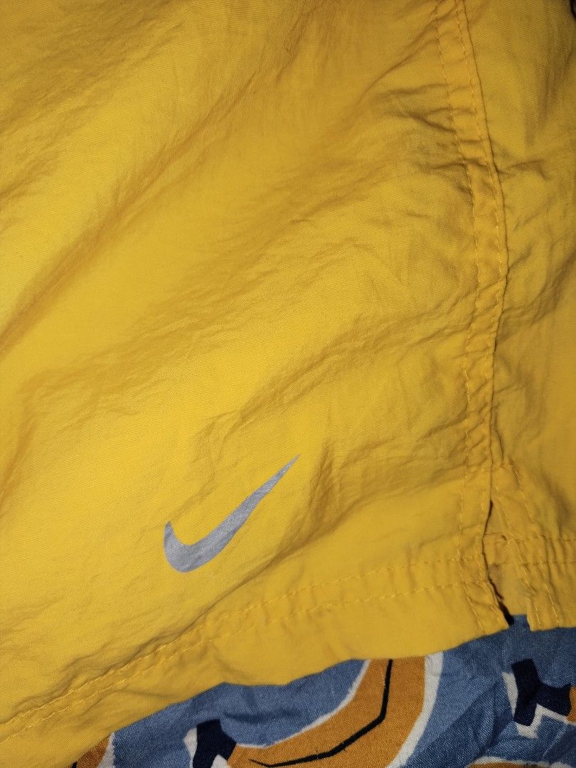 Nike Dri Fit Vintage Athletic Short (Category: Shorts) located in Mabalacat. Submitted by al_amin_thrift (Listing ID 1463451713, Image 2). Description: ⚡ Nike Dri-FIT — Vintage Yellow Woven Athletic Shorts — Size XL L17 W Brand: Nike — Authentic vintage tag Size: XL — Elastic waist + drawstring — relaxed fit Color: Bright Yellow / Gold Fabric: Lightweight 100% Polyester shell — quick-dry; breathable mesh inner lining ✨ Details: - Iconic retro Nik