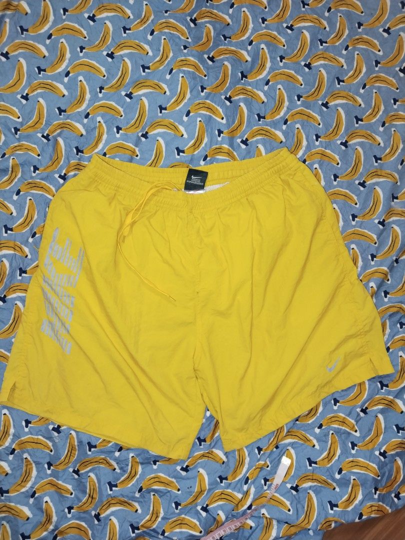 Nike Dri Fit Vintage Athletic Short (Category: Shorts) located in Mabalacat. Submitted by al_amin_thrift (Listing ID 1463451713, Image 1). Description: ⚡ Nike Dri-FIT — Vintage Yellow Woven Athletic Shorts — Size XL L17 W Brand: Nike — Authentic vintage tag Size: XL — Elastic waist + drawstring — relaxed fit Color: Bright Yellow / Gold Fabric: Lightweight 100% Polyester shell — quick-dry; breathable mesh inner lining ✨ Details: - Iconic retro Nik
