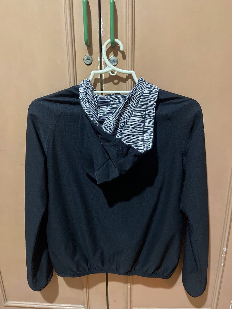 Nike Dri-FIT Hooded Zip-Up Jacket (Category: Coats, Jackets and Outerwear) located in Quezon City. Submitted by donnabelle7572 (Listing ID 1463451619, Image 2). Description: - Black Nike Dri-FIT hooded jacket - Full zip closure - Perforated fabric on front and sleeves for enhanced breathability - Striped lining inside the hood - Elasticated hem for a snug fit - Ideal for workouts or casual wear.