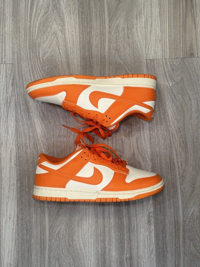 Nike Dunk Low Orange White (Category: Casual Shoes) located in Manila. Submitted by silent_dosss (Listing ID 1463378818, Image 2). Description: - Classic orange and white Nike Dunks - Low-top silhouette - Features iconic Nike branding on the heel - Bright orange laces for a pop of color - Comes in a clear shoe box - Ideal for everyday casual wear.