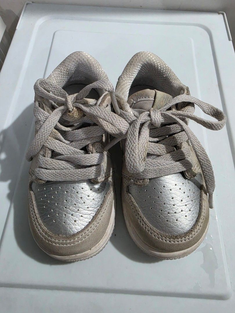 Nike Jordan 1 Low Shoes Toddler Silver (Category: Babies & Kids Fashion) located in Manila. Submitted by shieladmd (Listing ID 1463432021, Image 1). Description: - Cute baby Nike Jordan 1 Low shoes - Silver color with white soles - Lace-up closure - Ideal for babies learning to walk or for style - Shows some signs of wear, but still in good usable condition - Perfect for little sneakerheads.