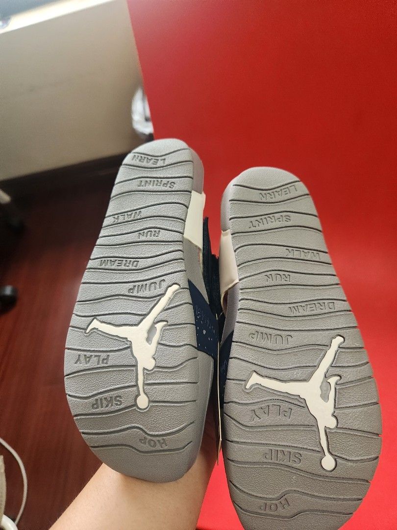 Nike Jordan Kids Sandals (Category: Babies & Kids Fashion) located in Makati City. Submitted by mikamix (Listing ID 1463366180, Image 2). Description: - Navy blue Jordan sandals for little ones - White speckle pattern - Easy strap closure for quick on and off - Fun words on soles: 'play', 'skip', 'jump', 'run', 'walk', 'learn' - Perfect for active kids - Comes with original tag size US 2Y.
