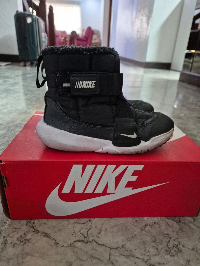 Nike Kids Winter Boots Black White (Category: Babies & Kids Fashion) located in Naga. Submitted by curatedpreloveditems (Listing ID 1463423496, Image 2). Description: - Black and white Nike winter boots for kids - Padded upper with adjustable straps for a secure fit - Soft faux fur lining for ultimate warmth - Easy slip-on design for convenience - Ideal for keeping little feet cozy in cold weather - Anti Slip in Ice.