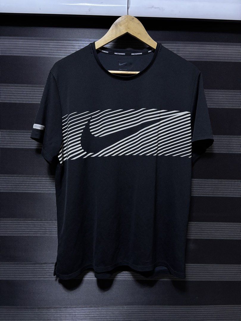 Nike Miler Flash Running T-Shirt Black Reflective Silver (Category: Activewear) located in Pasig City. Submitted by abogadosupremo (Listing ID 1463471211, Image 1). Description: - Nike Miler Flash running t-shirt - Color: Black with reflective silver graphic detail - Material: Lightweight and breathable fabric - Ideal for: Running or everyday wear - 100% Legit and Authentic - Very Good Condition - Can pass as bnew cause i used it once - Color may