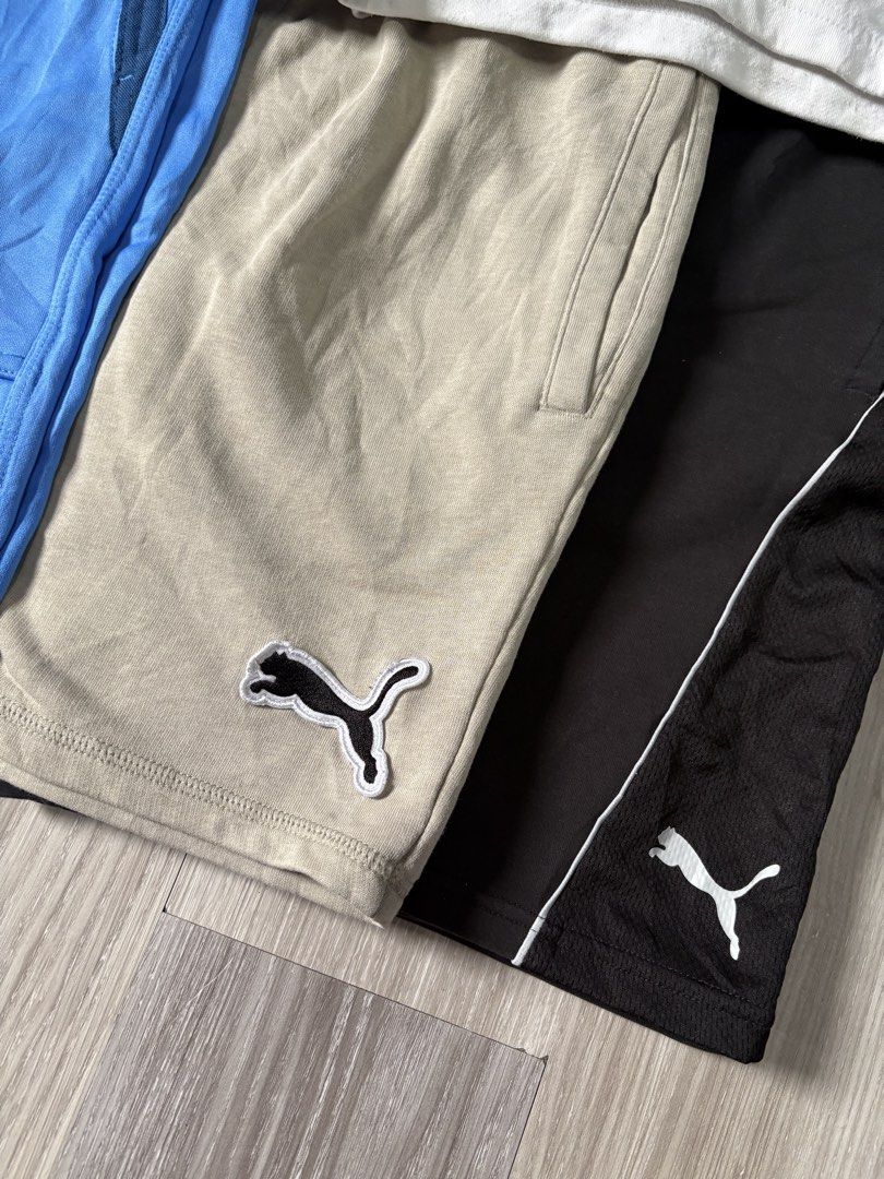 Nike, Puma, Russell Athletic Shorts Bundle (Category: Shorts) located in Rizal. Submitted by thriftdrip.402 (Listing ID 1463495852, Image 2). Description: - Bundle of 5 pairs of men's shorts - Brands include Nike, Puma, and Russell Athletic - Assorted colors: light blue, white with green, tan, black, and grey/blue/dark grey - Features elastic waistbands on all pairs - Ideal for sports activities or casual everyday wear.