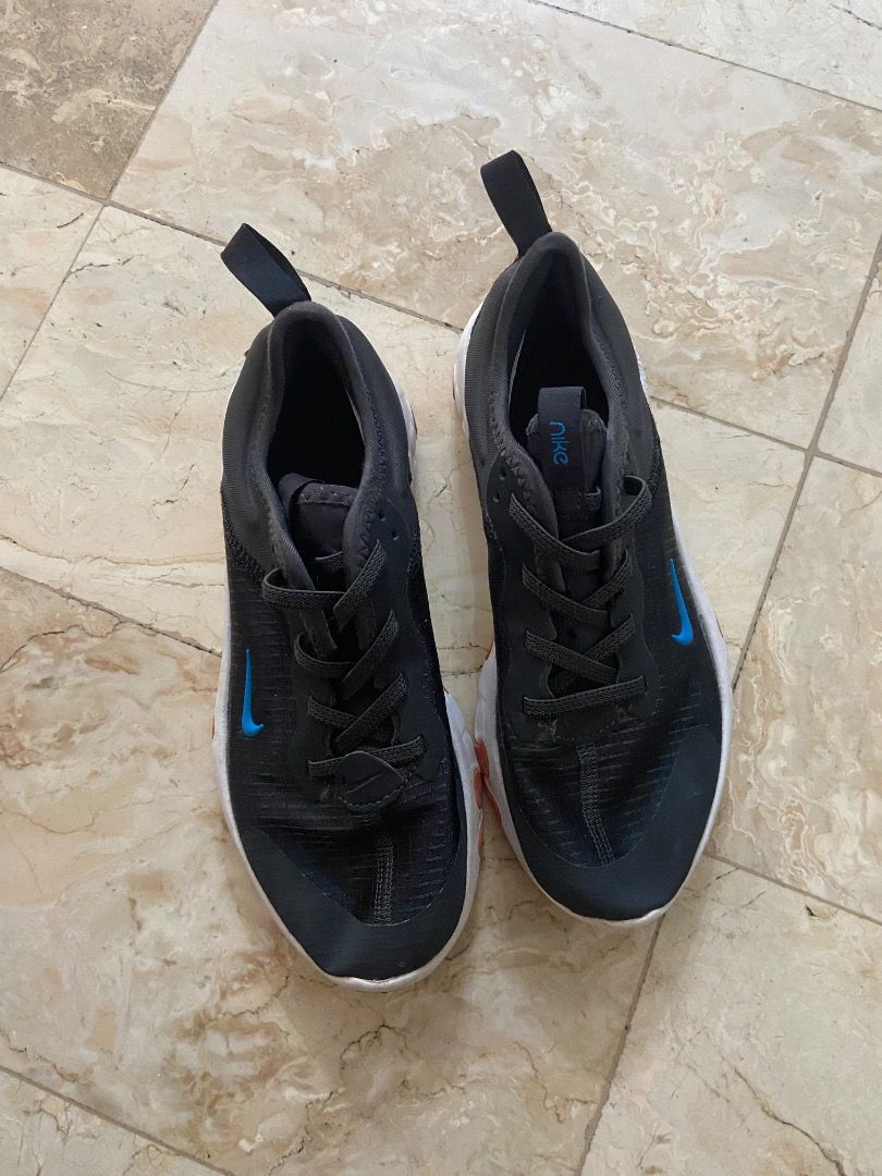 Nike React Vision Kids' Sneakers Black Blue Orange US1 (Category: Sneakers) located in Paranaque City. Submitted by sengloveima (Listing ID 1463396695, Image 1). Description: - Nike React Vision sneakers for kids - Size: 1Y (US) - Color: Black with blue swoosh and orange sole accents - Closure: Lace-up - Features: Comfortable and lightweight for everyday wear - Condition: Please check photos for details.